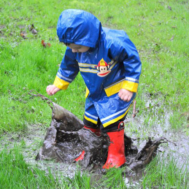 Little Boy in Wet Yard